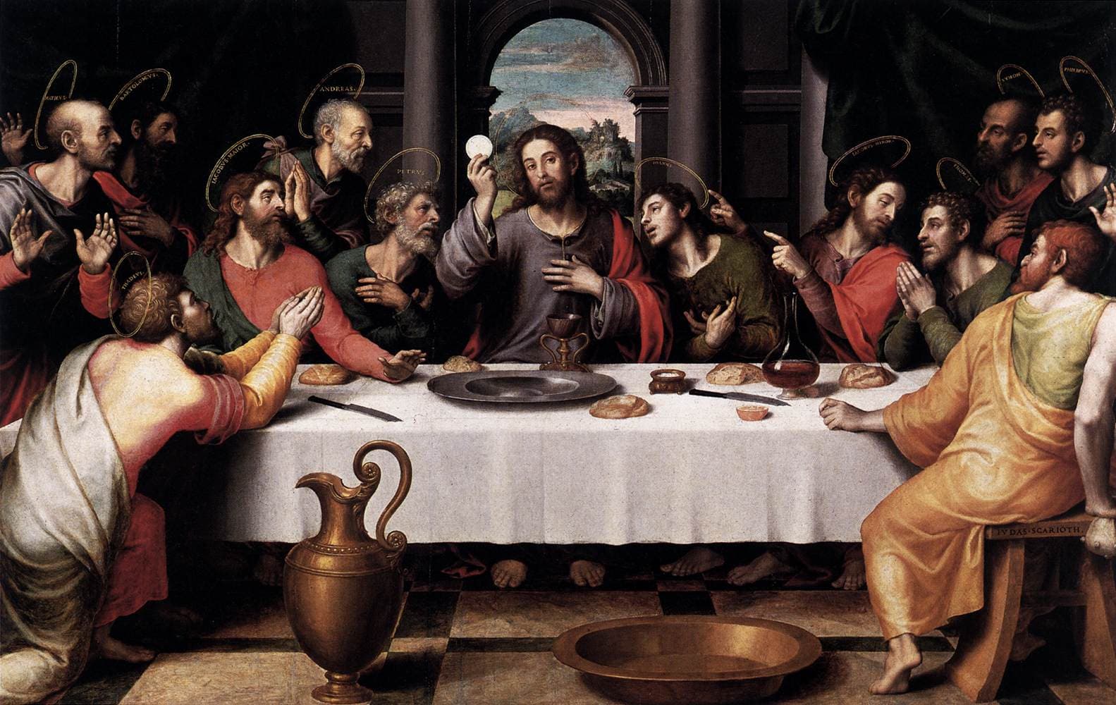 Jesus holds a white host at the center of a table surrounded by the apostles in Juan de Juanes's painting of the Last Supper