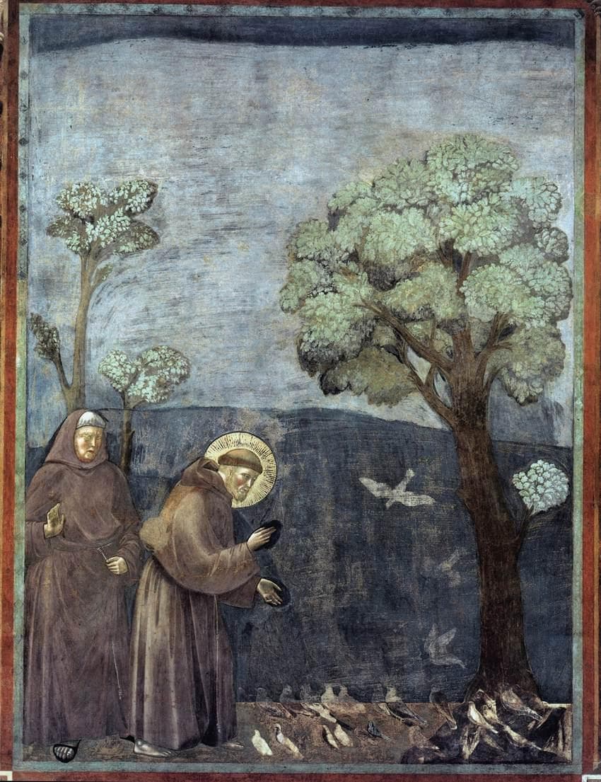 Medieval fresco showing Saint Francis bending toward a group of birds while another friar stands nearby