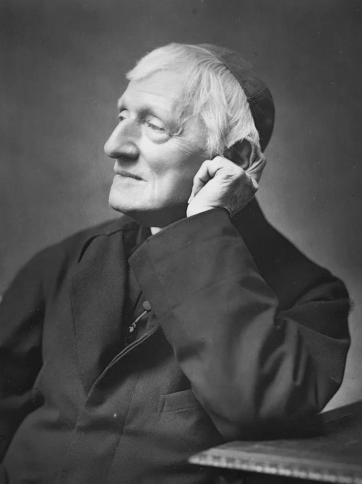 John Henry Newman: black-and-white photograph of an elderly cleric seated with his head resting on his hand