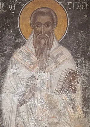 Titus: faded fresco of an elderly bishop holding a book