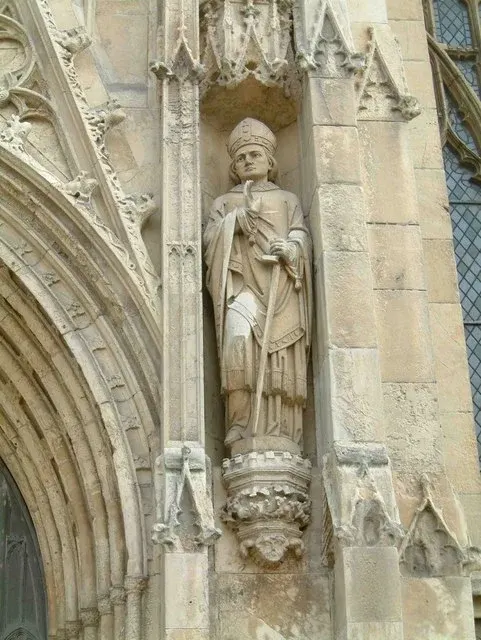 John of Beverley: stone bishop statue in a niche on a church exterior