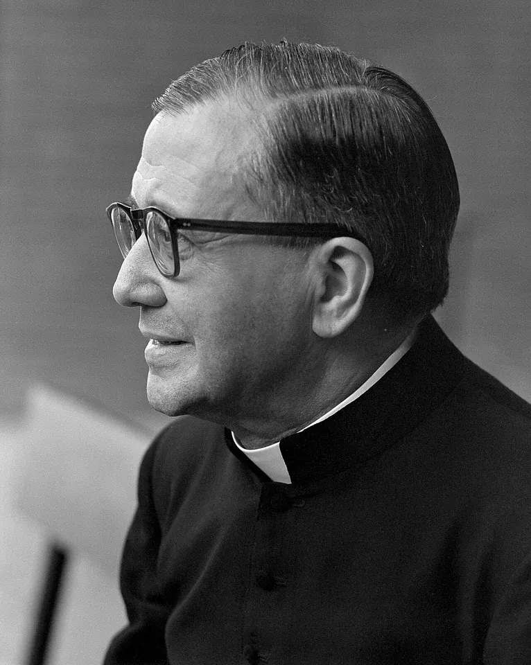 Josemaría Escrivá: black-and-white profile photograph of a priest wearing glasses