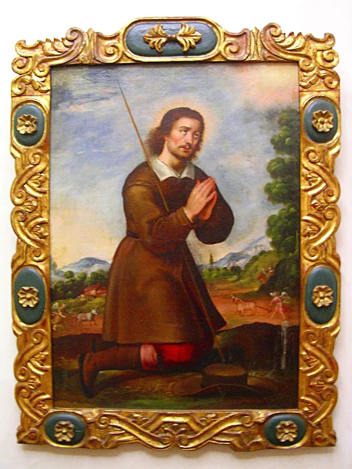 Isidore the Farmer: framed painting of a man kneeling in a cultivated landscape