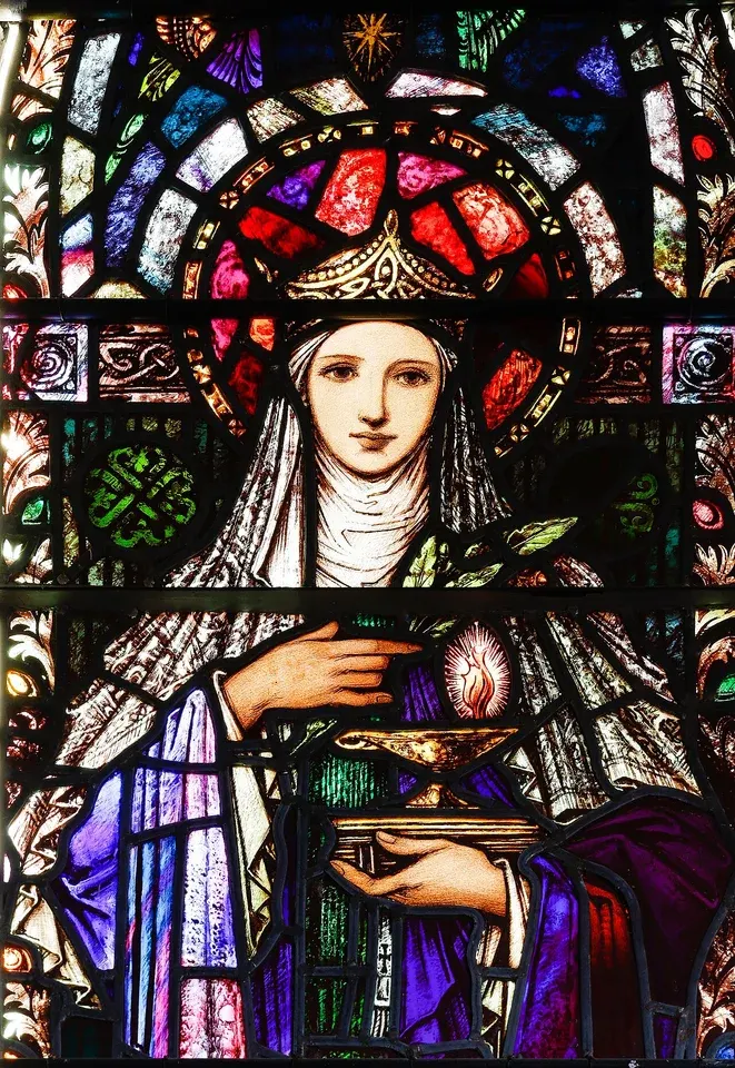 Brigid of Kildare: stained-glass woman in a veil holding a lamp