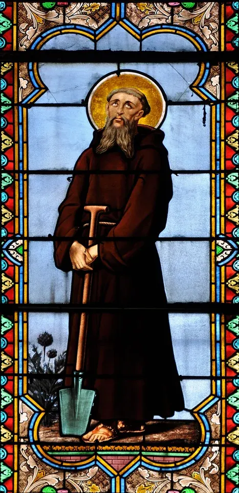 Fiacre: stained-glass monk holding a spade