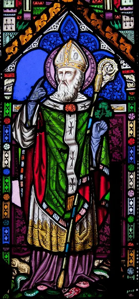 Patrick: stained-glass bishop in green vestments holding a staff
