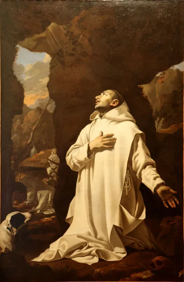 Bruno of Cologne: painting of a monk in a white habit praying in a rocky landscape