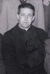 Alberto Hurtado: black-and-white photograph of a priest in a dark cassock
