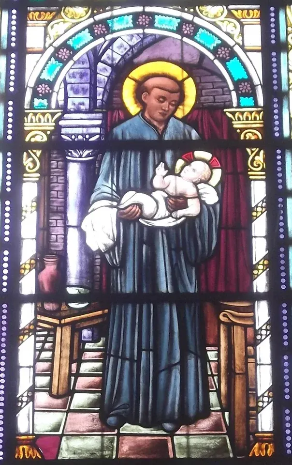 Benedict the African: stained-glass friar holding the infant Jesus