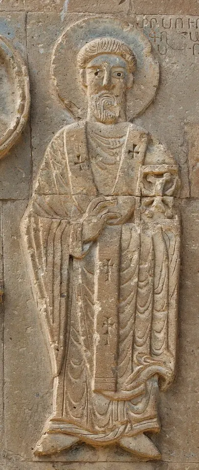 Gregory the Illuminator: stone relief of a haloed bishop holding a cross and book