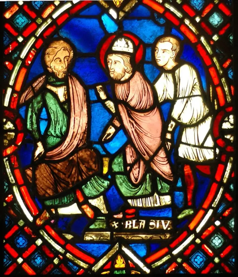 Blaise of Sebaste: stained-glass scene of a bishop with kneeling figures