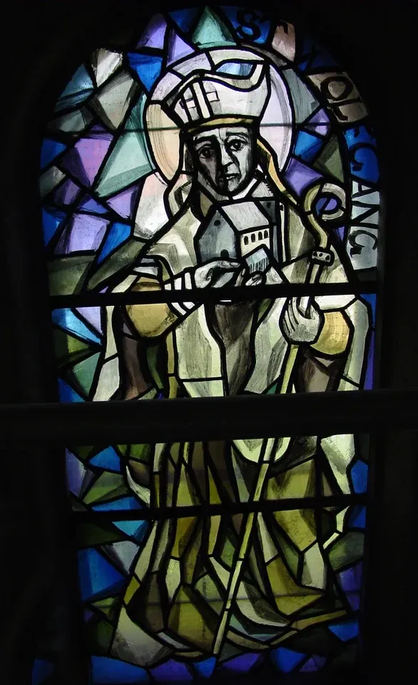 Wolfgang: stained-glass bishop holding a staff and model church