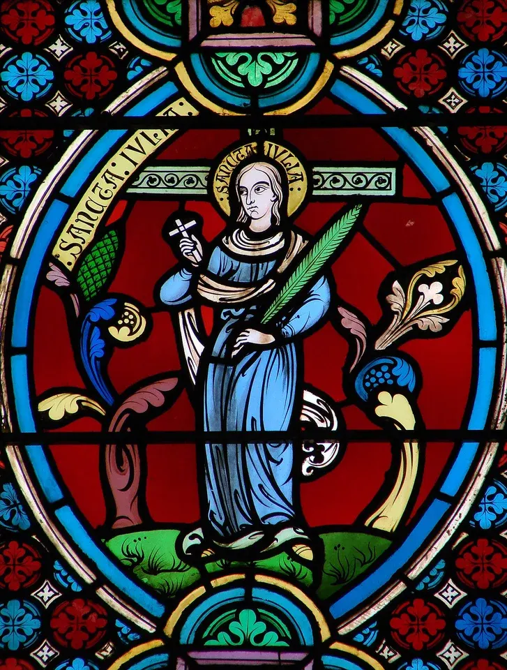 Julia of Corsica: stained-glass woman holding a palm branch
