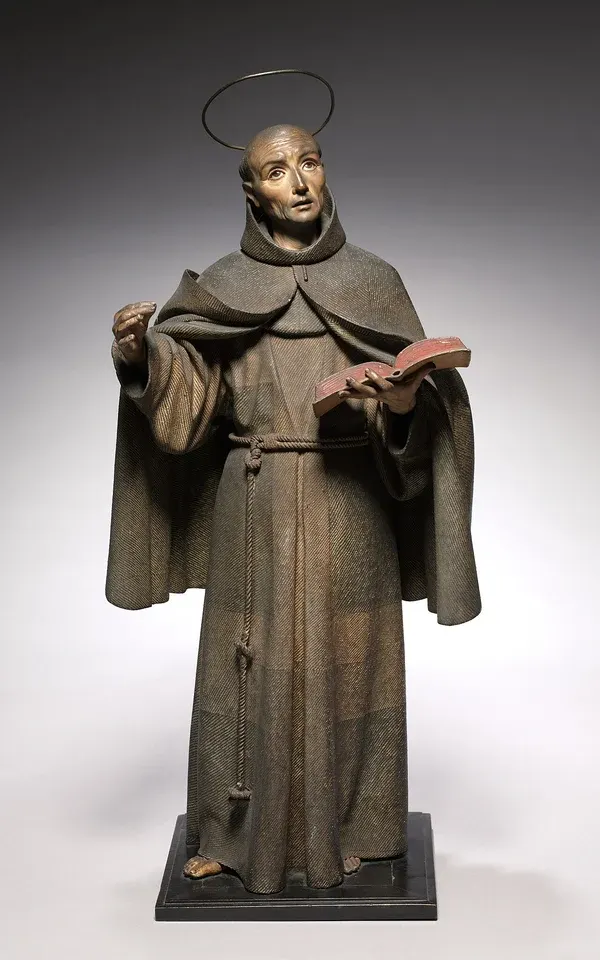Peter of Alcántara: carved statue of a friar holding an open book