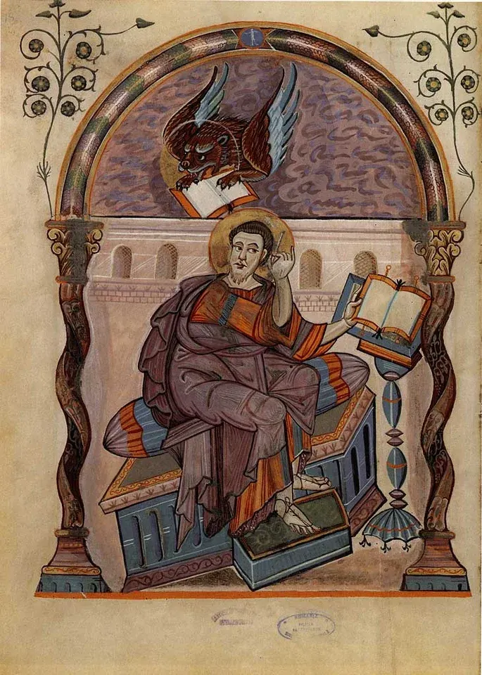 Mark the Evangelist: manuscript illustration of an evangelist writing, with a winged lion above